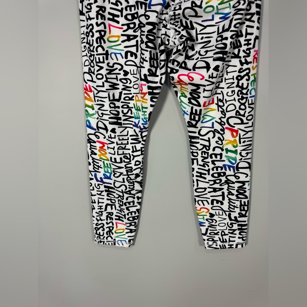 NWOT ATHLETA ELATION TRAIN 7/8
Tight Leggings PRIDE Graffiti words L - Picture 11 of 13